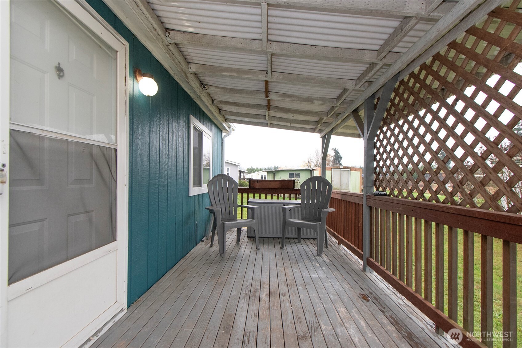 491 Mill Road, Unit 30 Sequim, WA 98382 - Photo 35 of 39 a view of a balcony with furniture