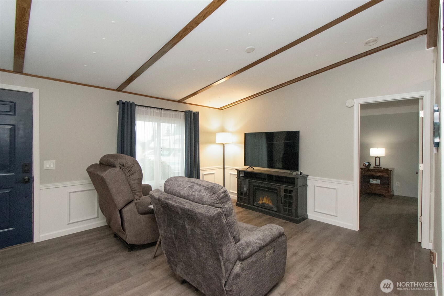 491 Mill Road, Unit 30 Sequim, WA 98382 - Photo 5 of 39 a living room with furniture and a flat screen tv