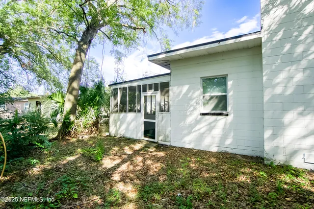 a view of a house with a small yard