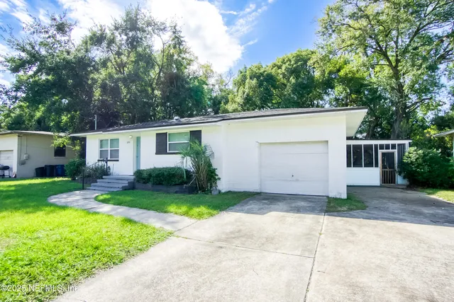 front view of a house with a yard