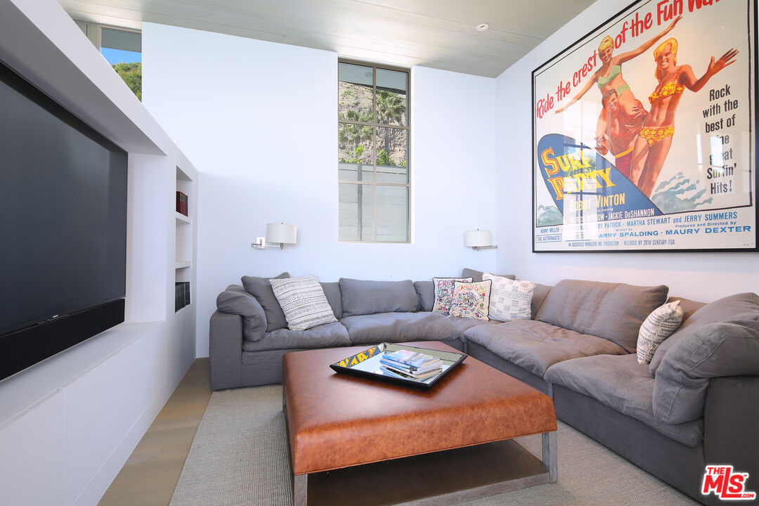 23956 Malibu Road Malibu, CA 90265 - Photo 11 of 26 a living room with furniture and a flat screen tv