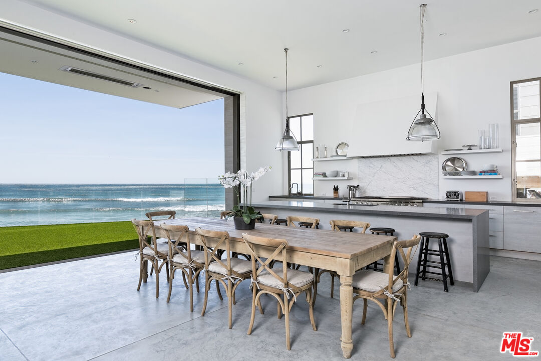 23956 Malibu Road Malibu, CA 90265 - Photo 2 of 26 a kitchen with a table and chairs in it