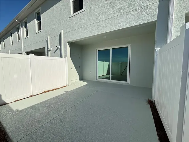 a swimming pool with outdoor seating and city view