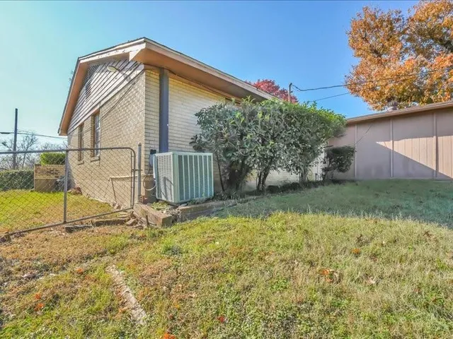a house view with a backyard space