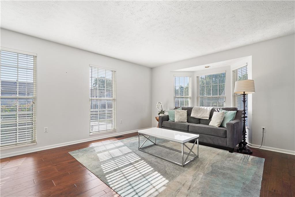 732 Venango Avenue Pittsburgh, PA 15209 - Photo 3 of 25 The living room is flooded with natural light and is enhanced by the bay window and stunning hardwoods.
