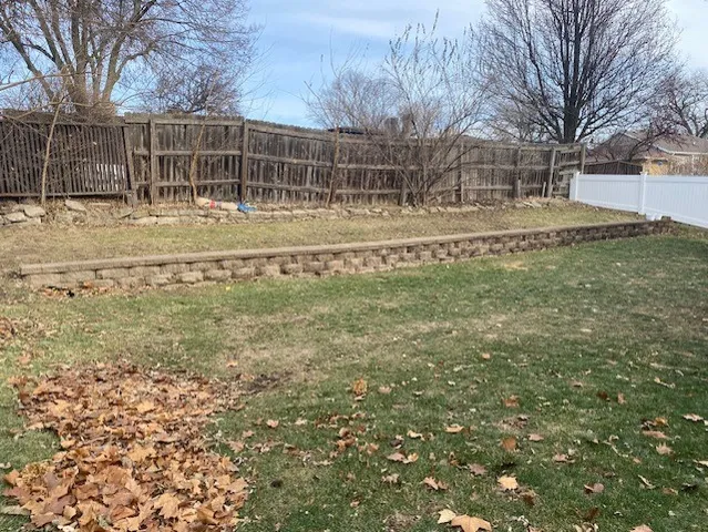 a view of outdoor space with garden and trees