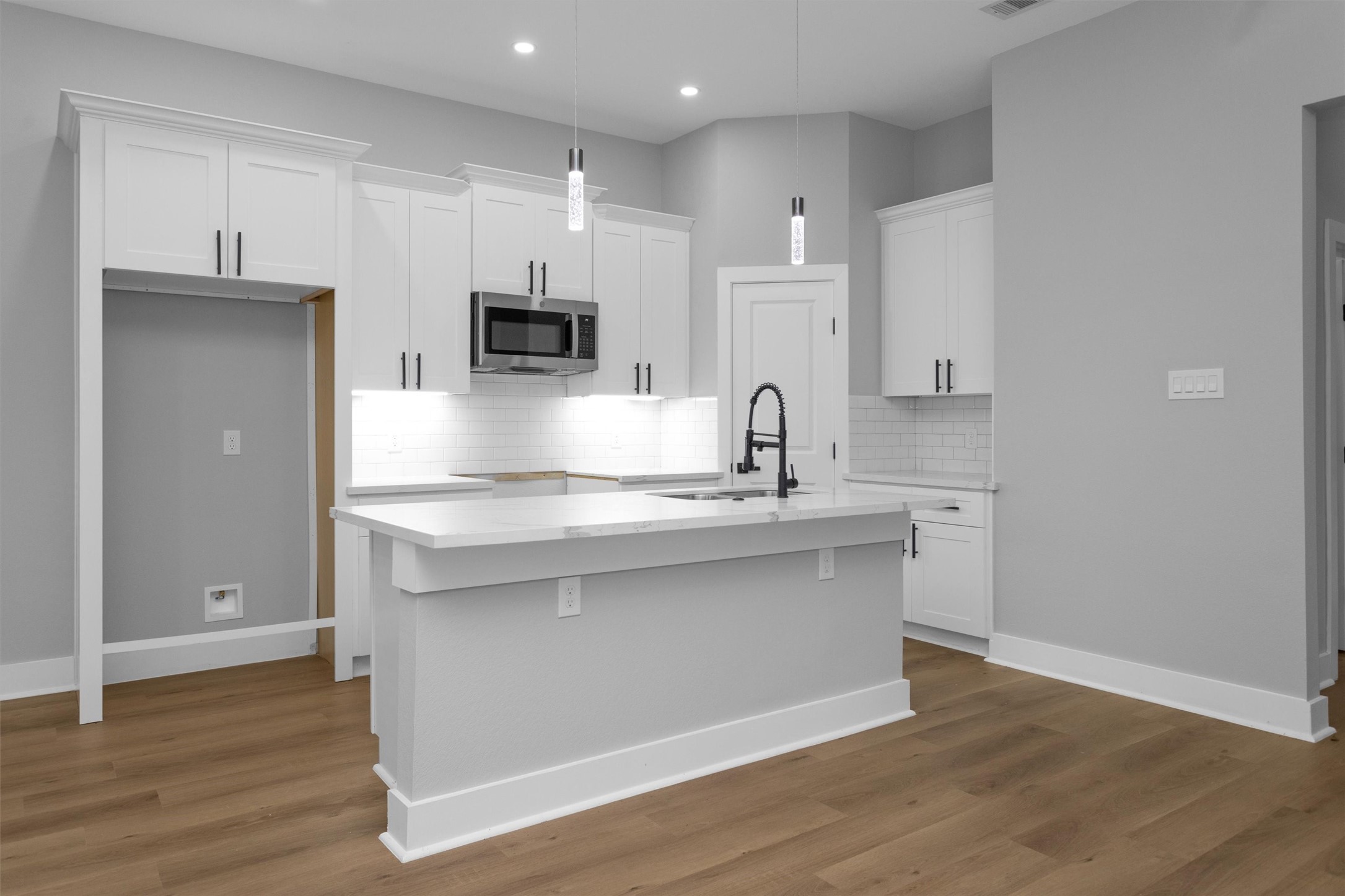 6918 Dumble Street, Unit B Houston, TX 77021 - Photo 12 of 31 a kitchen with stainless steel appliances a sink stove and microwave