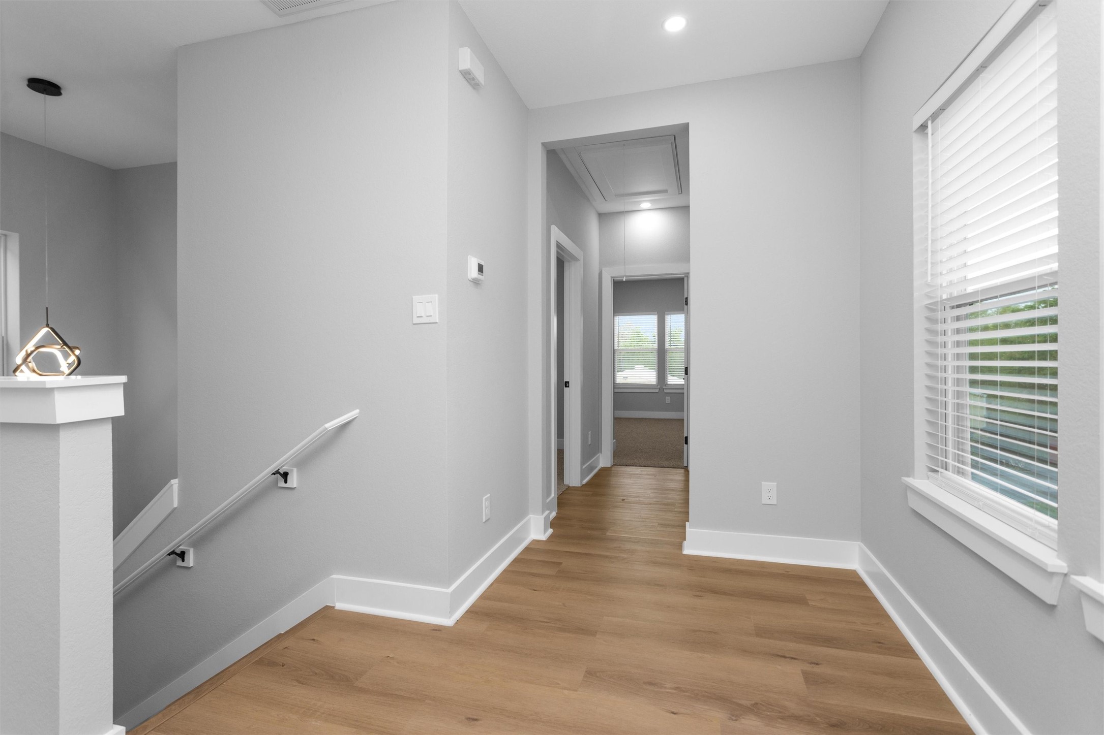6918 Dumble Street, Unit B Houston, TX 77021 - Photo 17 of 31 a view of a hallway with wooden floor and a bathroom