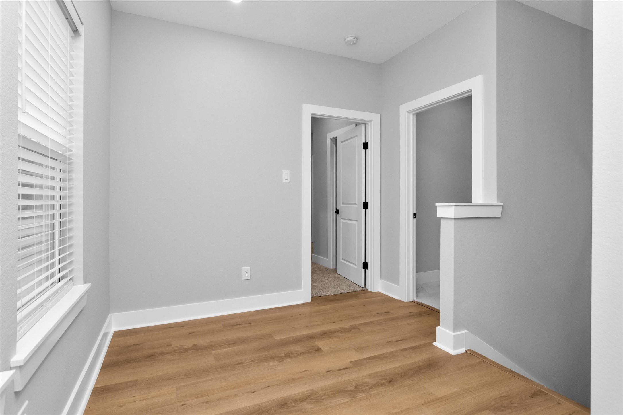 6918 Dumble Street, Unit B Houston, TX 77021 - Photo 18 of 31 a view of empty room with wooden floor and fan