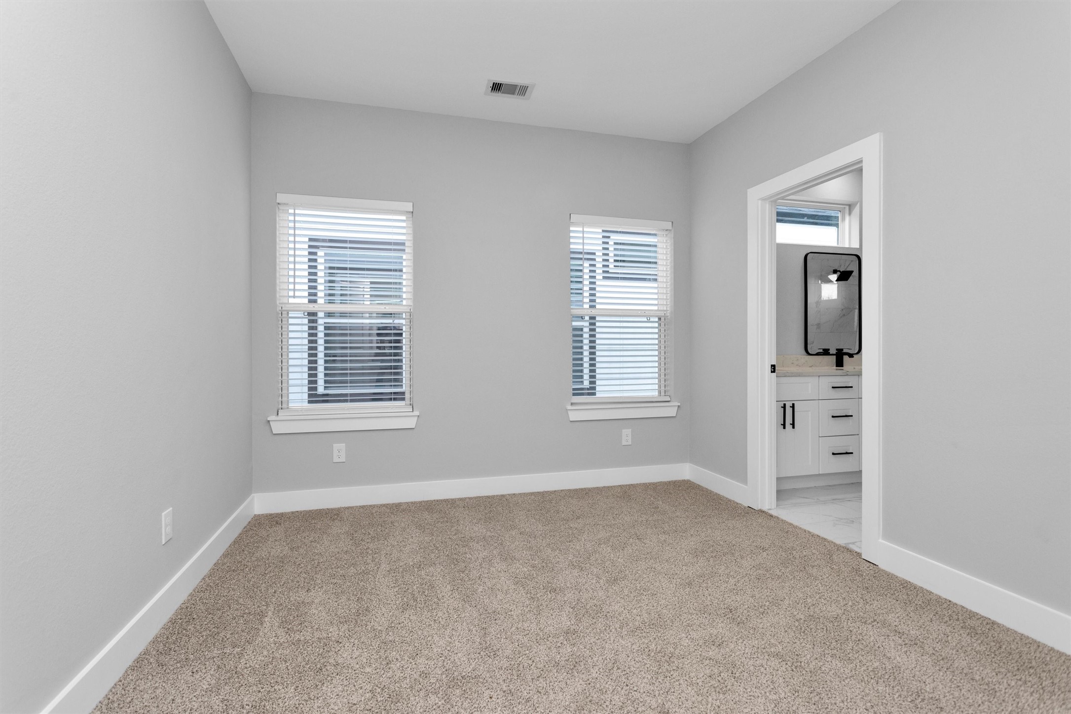 6918 Dumble Street, Unit B Houston, TX 77021 - Photo 23 of 31 an empty room with windows and closet