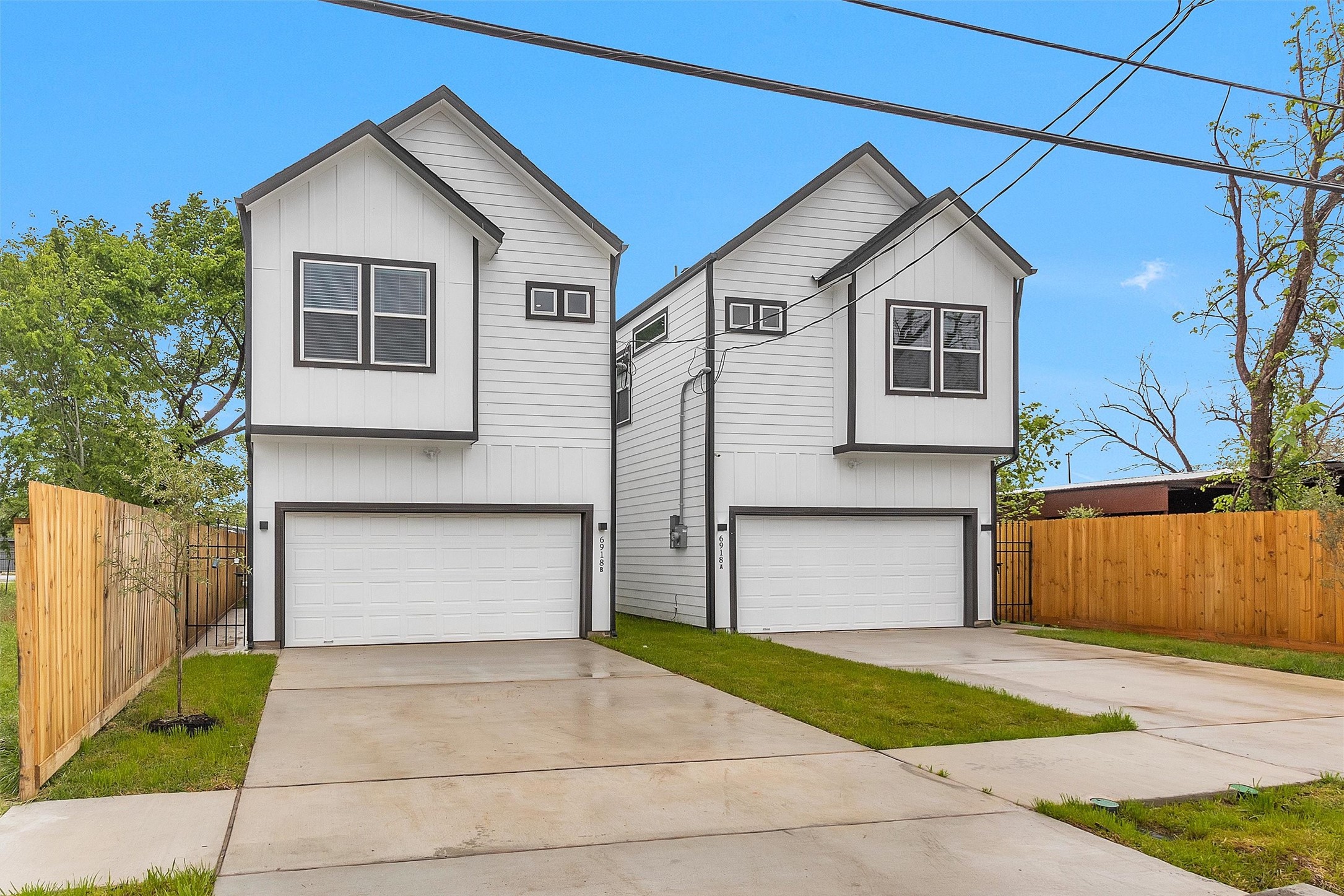 6918 Dumble Street, Unit B Houston, TX 77021 - Photo 31 of 31 a front view of a house with a yard and garage