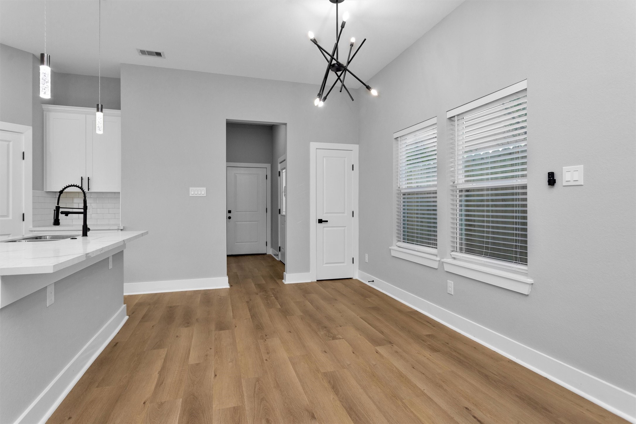 6918 Dumble Street, Unit B Houston, TX 77021 - Photo 7 of 31 a view of empty room with wooden floor and fan