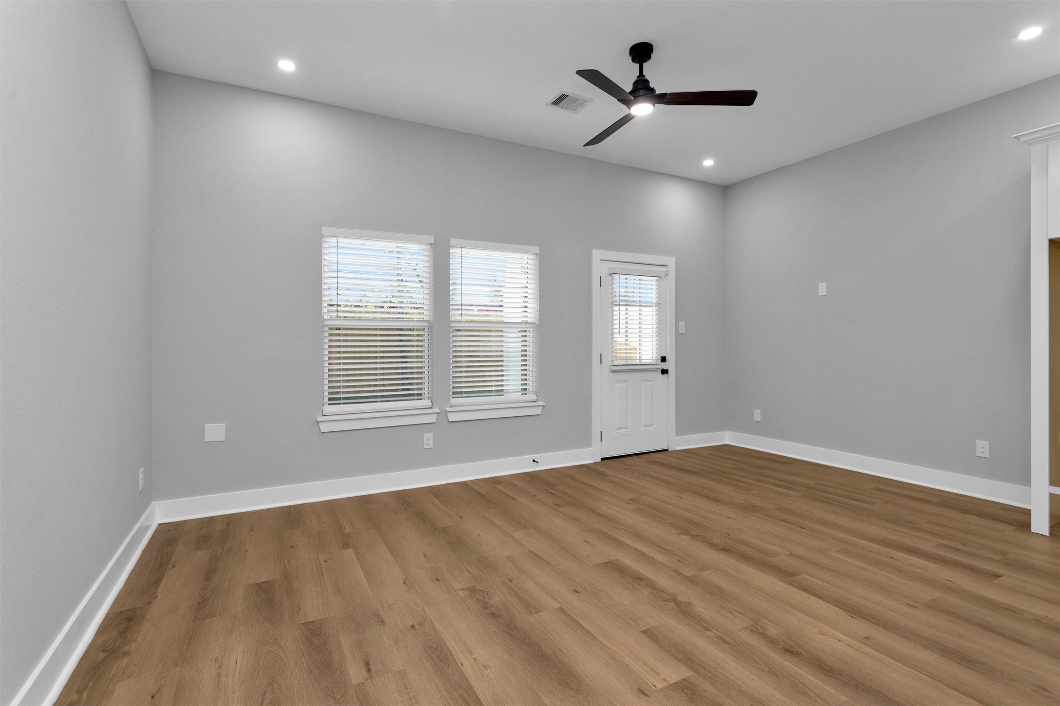6918 Dumble Street, Unit B Houston, TX 77021 - Photo 8 of 31 wooden floor in an empty room with a window