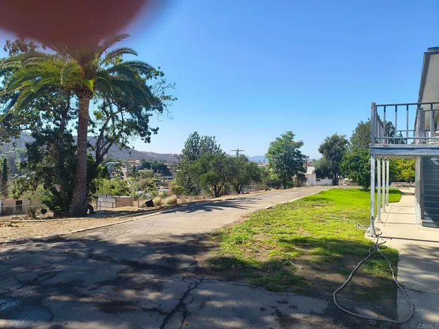 a view of a swimming pool with an outdoor space and seating area
