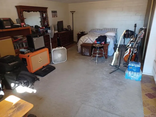 a living room with furniture a air conditioner vent and a window