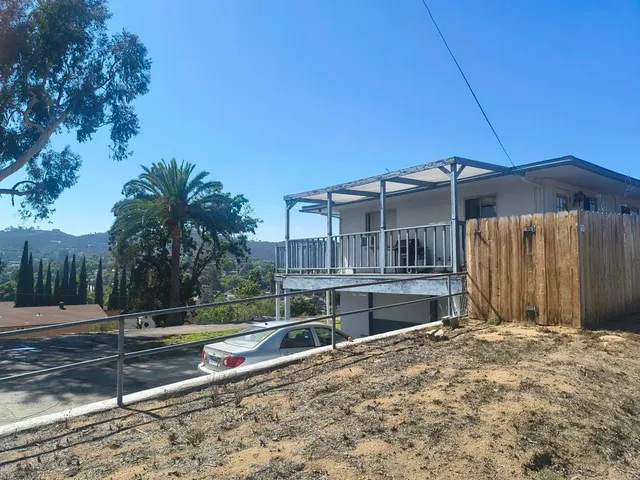 a house view with a backyard space