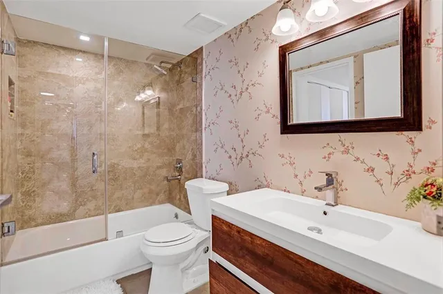 a kitchen with a sink and a stove top oven