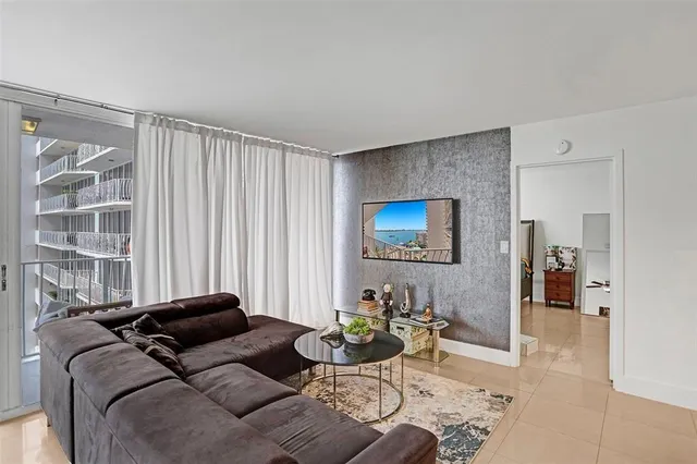 a living room with furniture and a window