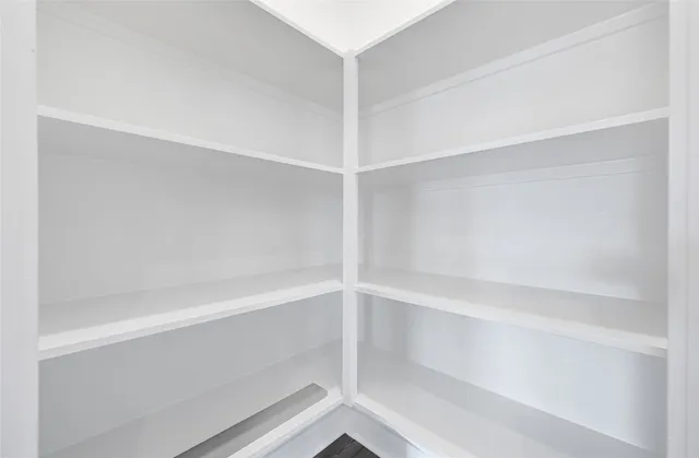 a view of an empty walk in closet