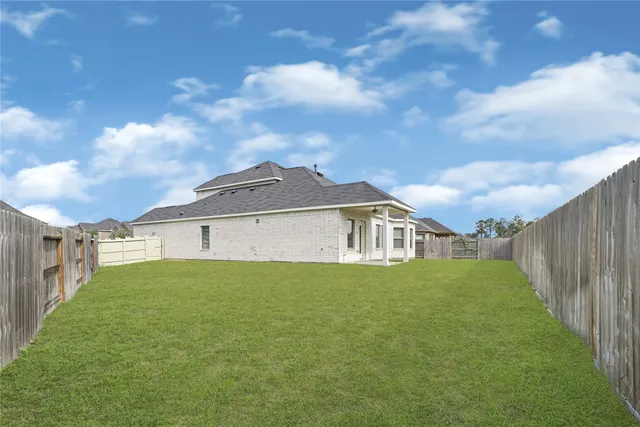 a front view of a house with yard