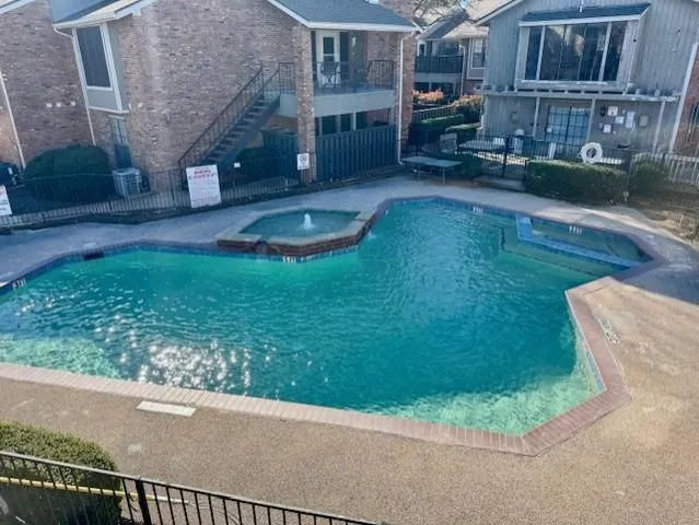 a backyard of a house with barbeque oven