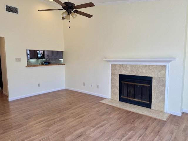 2733 Silver Creek Drive, Unit 205 Arlington, TX 76006 - Photo 2 of 13 a view of a livingroom with a fireplace and a ceiling fan