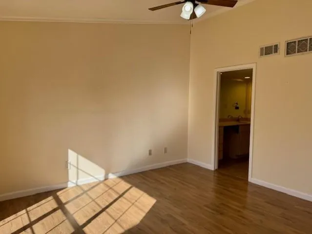 a view of a room with wooden floor