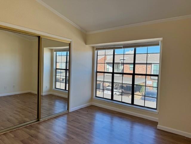2733 Silver Creek Drive, Unit 205 Arlington, TX 76006 - Photo 8 of 13 an empty room with wooden floor and windows