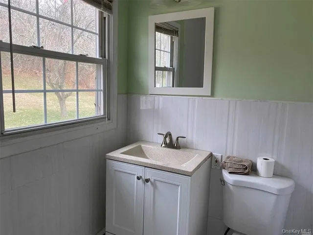 a view of bathroom with a sink and a vanity