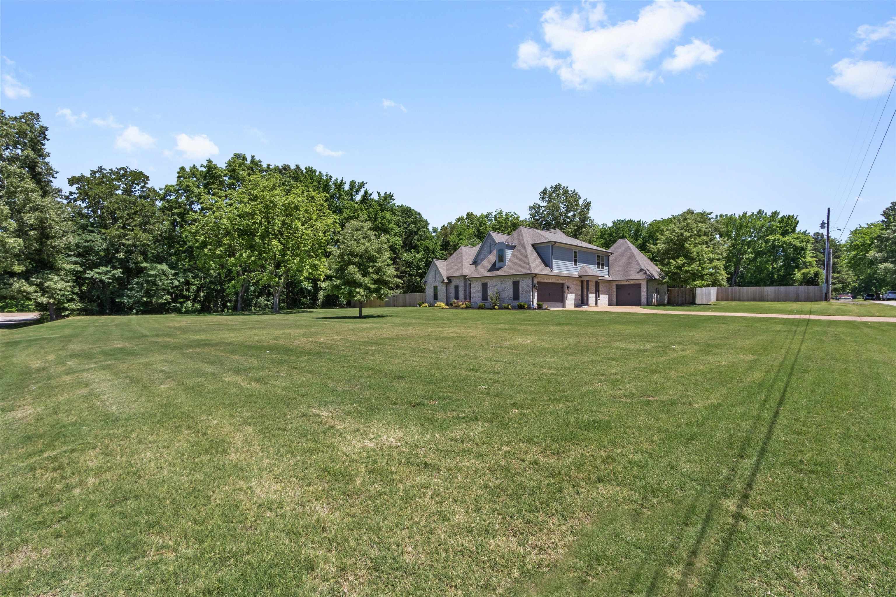 65 Watson Road Oakland, TN 38060 - Photo 3 of 40 a view of a house with a big yard