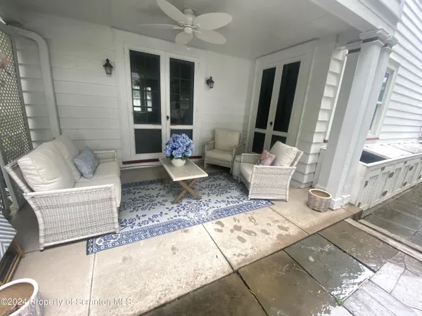 a living room with furniture and a rug