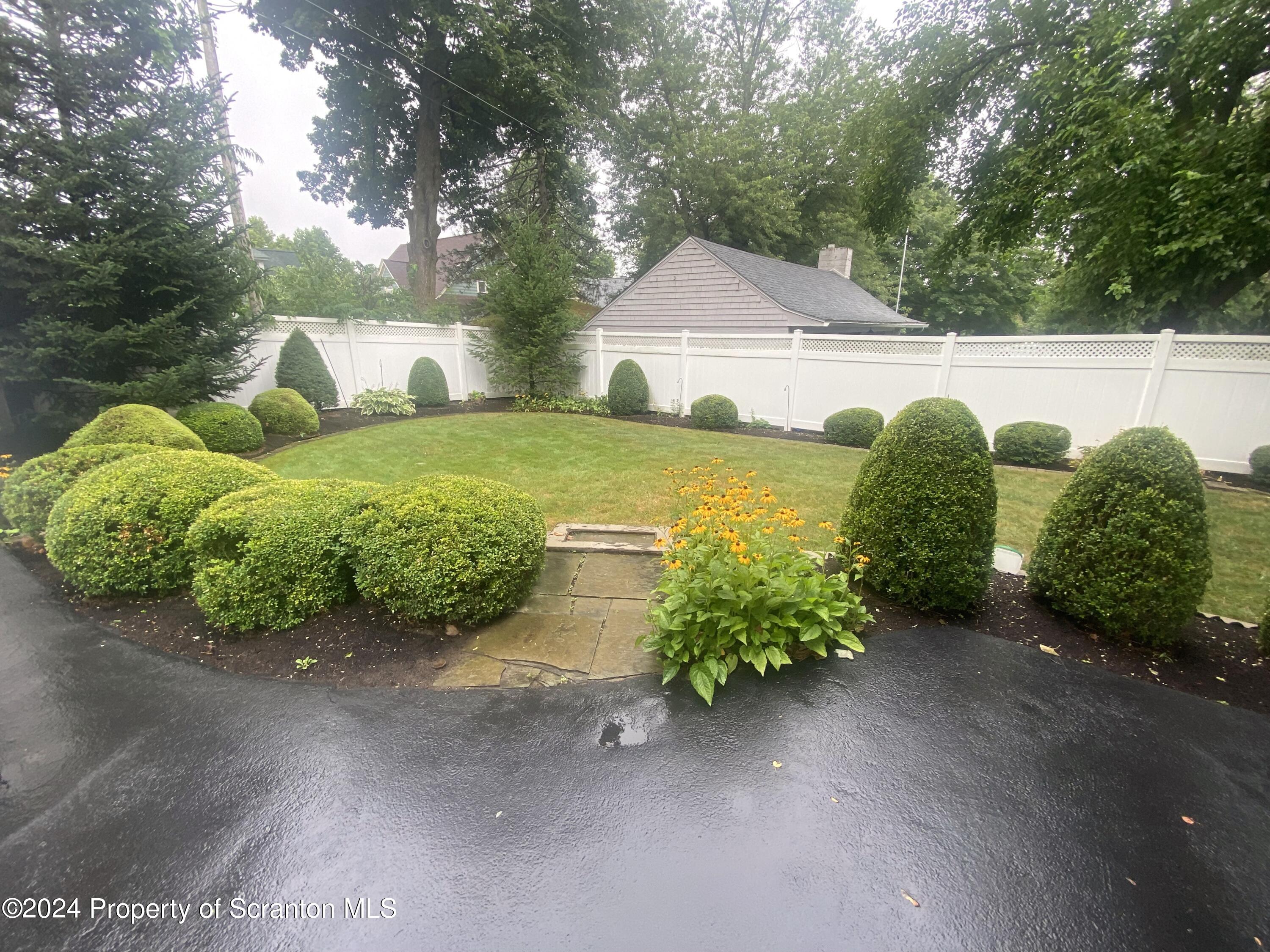 1008 Electric Street Scranton, PA 18509 - Photo 21 of 25 a view of a house with a yard and garage