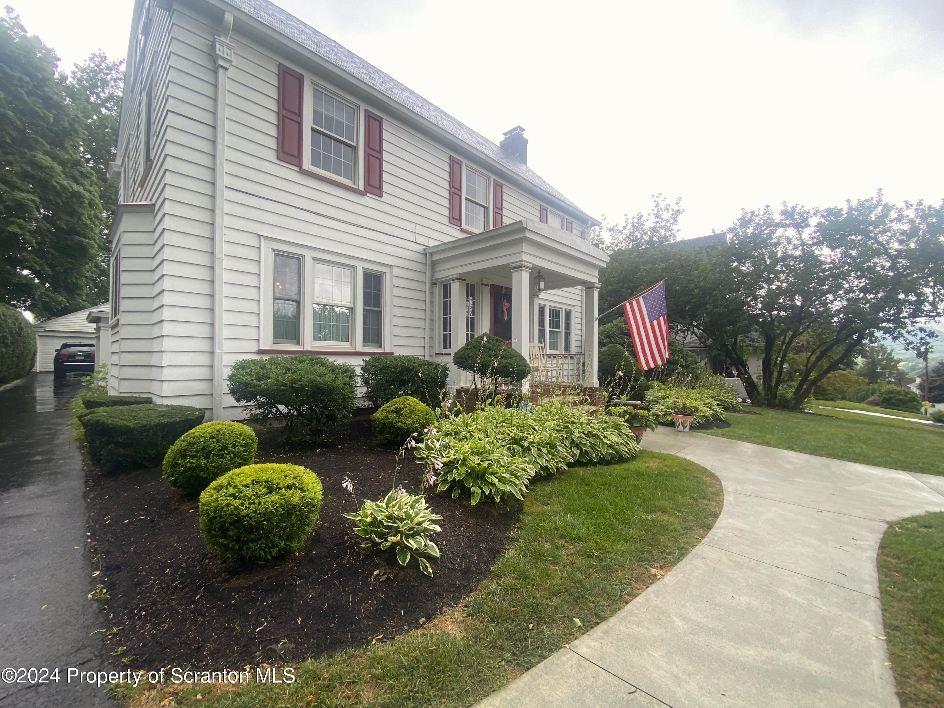 1008 Electric Street Scranton, PA 18509 - Photo 24 of 25 a front view of a house with garden