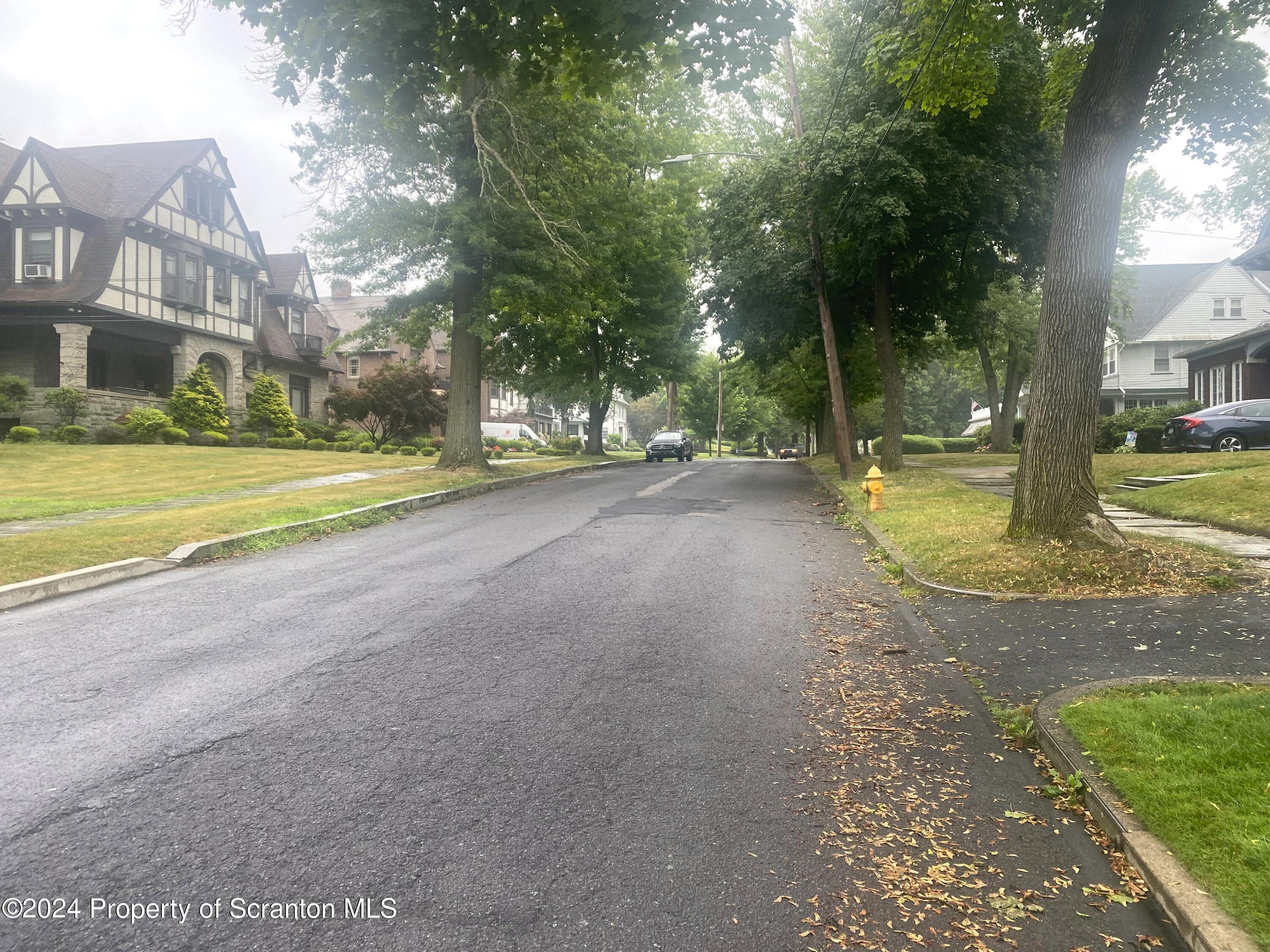1008 Electric Street Scranton, PA 18509 - Photo 25 of 25 a view of a house with a yard and swimming pool