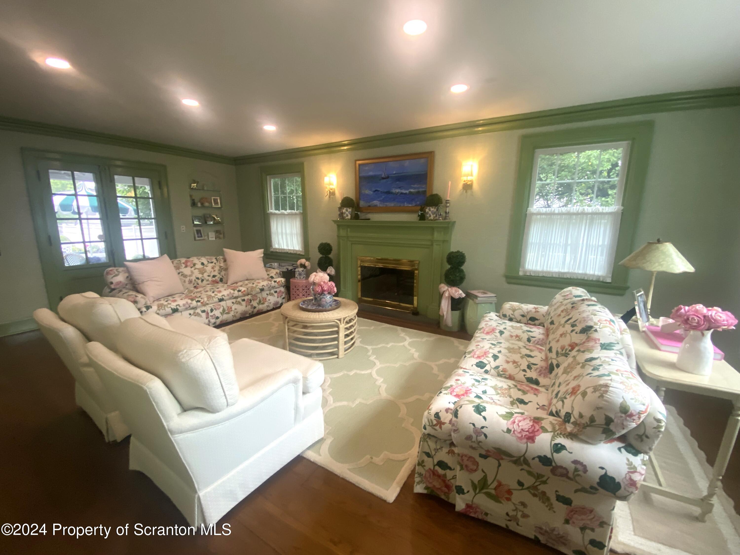 1008 Electric Street Scranton, PA 18509 - Photo 3 of 25 a living room with furniture and a fireplace