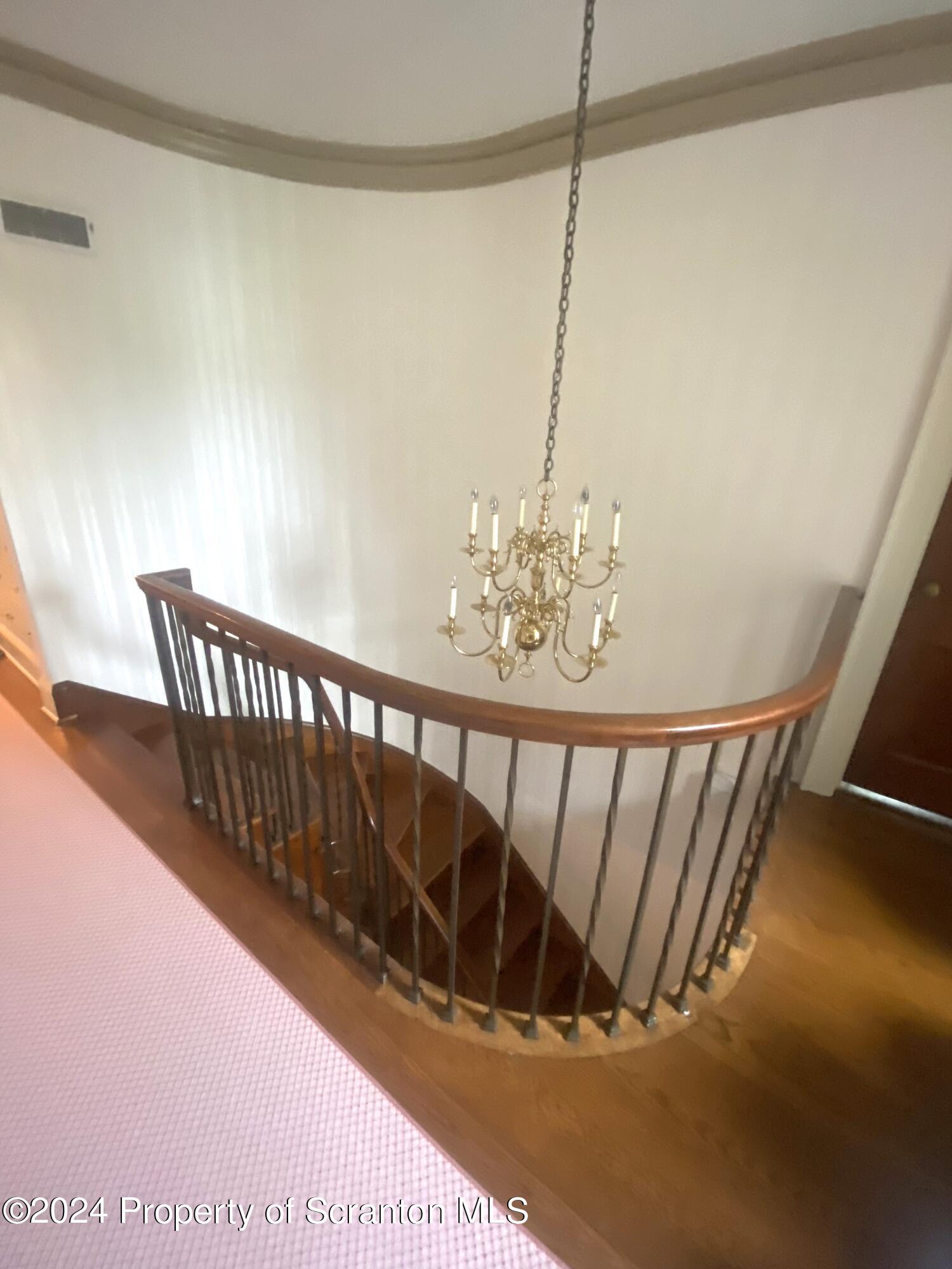 1008 Electric Street Scranton, PA 18509 - Photo 7 of 25 a view of staircase with railing and a chandelier
