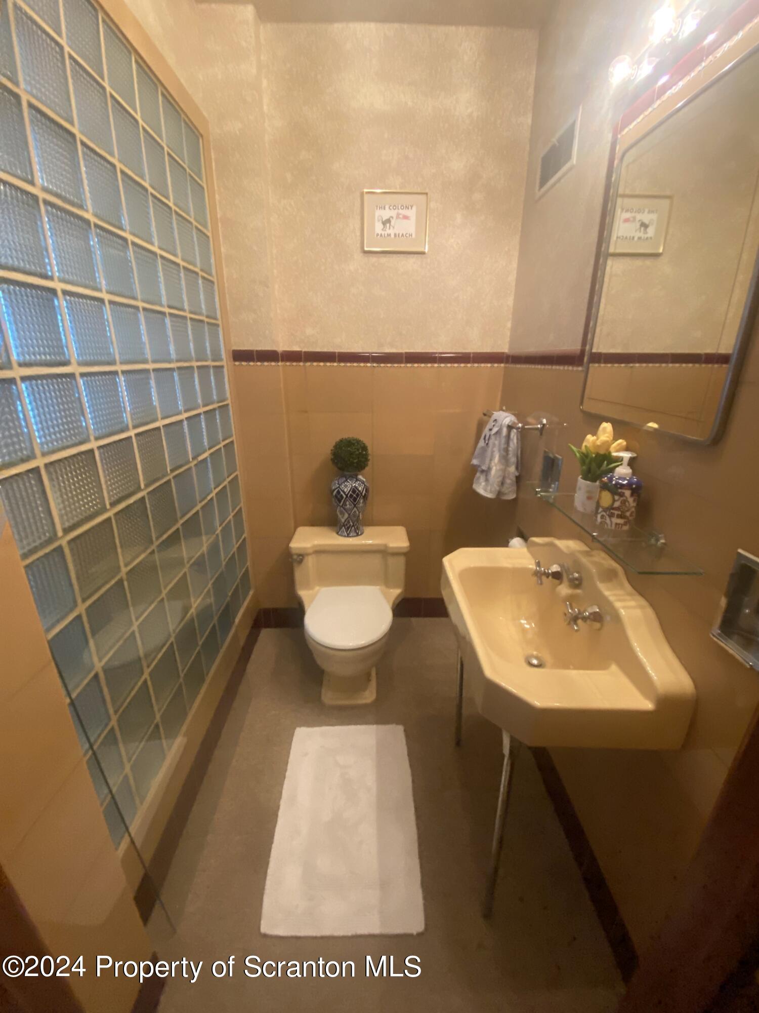 1008 Electric Street Scranton, PA 18509 - Photo 9 of 25 a bathroom with a sink toilet and shower