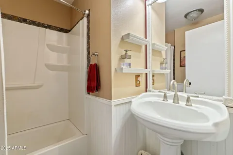 a bathroom with a sink and a mirror