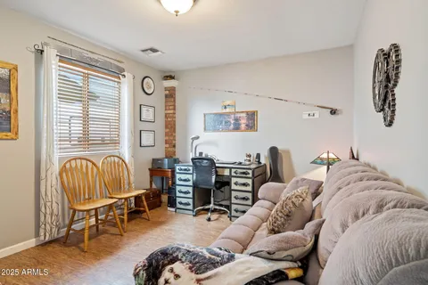 a bedroom with furniture and a window
