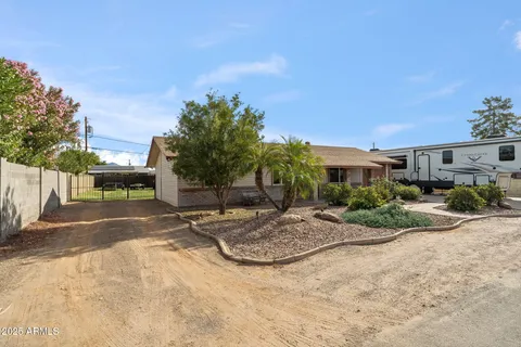 a view of backyard of a house