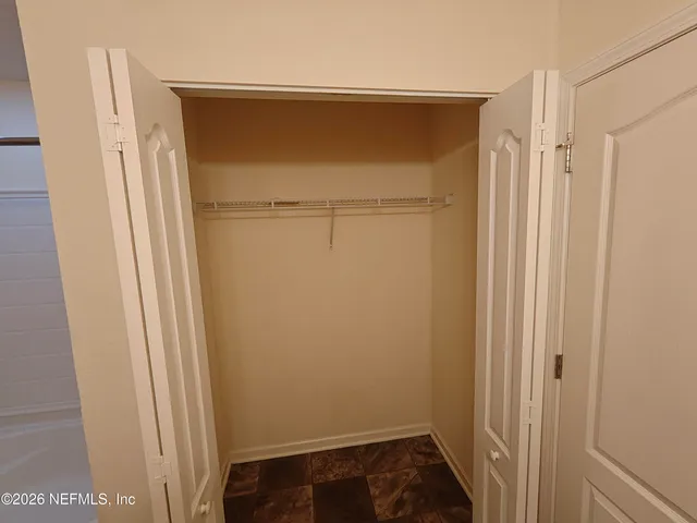 a view of an empty room with a sink