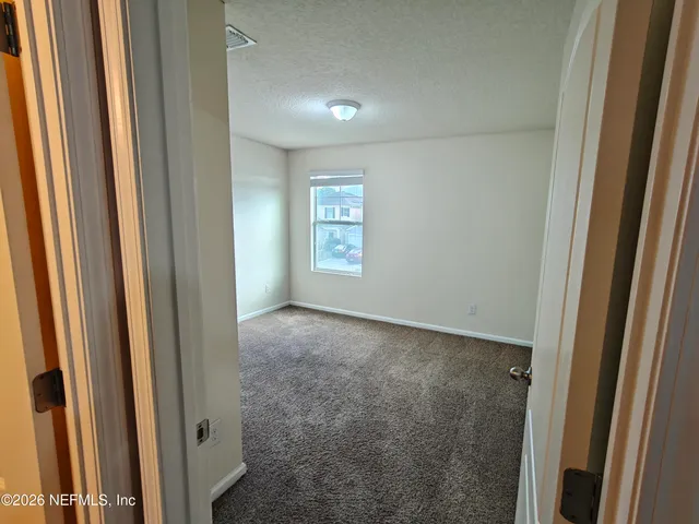 a view of small space with empty racks on the wall