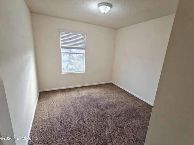 a house view with a backyard space