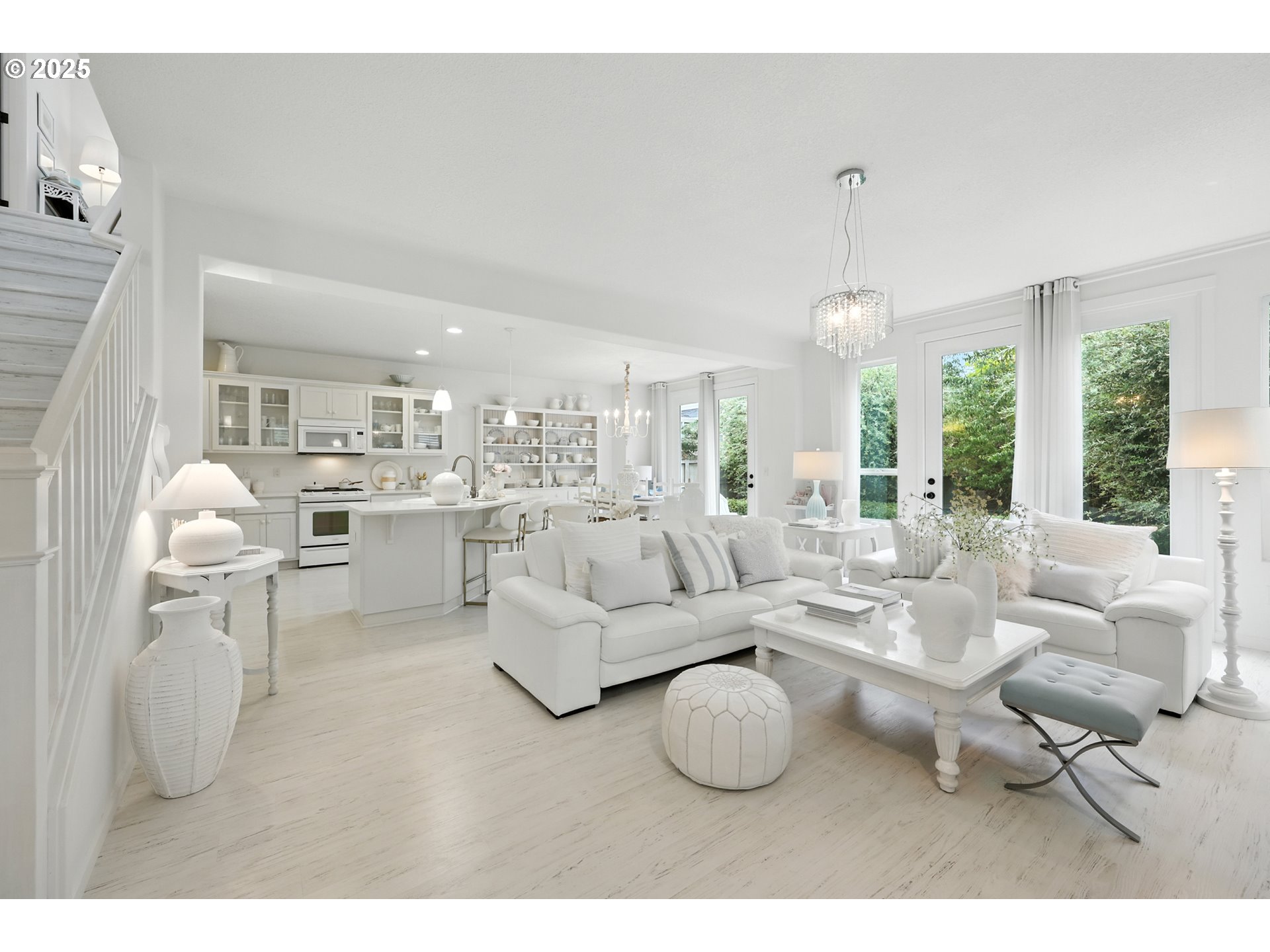 2210 South White Salmon Drive Ridgefield, WA 98642 - Photo 11 of 45 a living room with furniture a large window and a chandelier