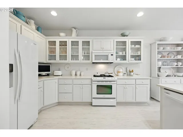 a kitchen with stainless steel appliances granite countertop a stove and a sink