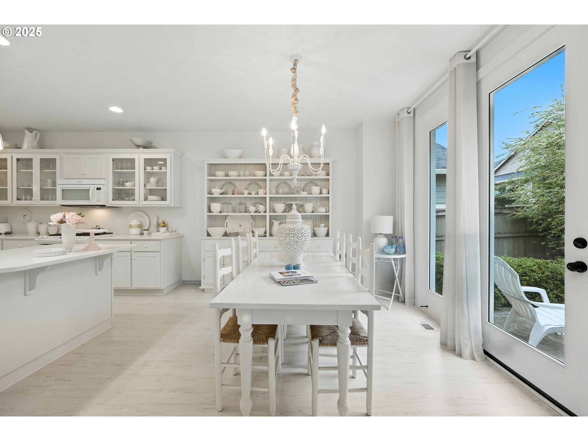 2210 South White Salmon Drive Ridgefield, WA 98642 - Photo 19 of 45 a kitchen with a table chairs stove and cabinets
