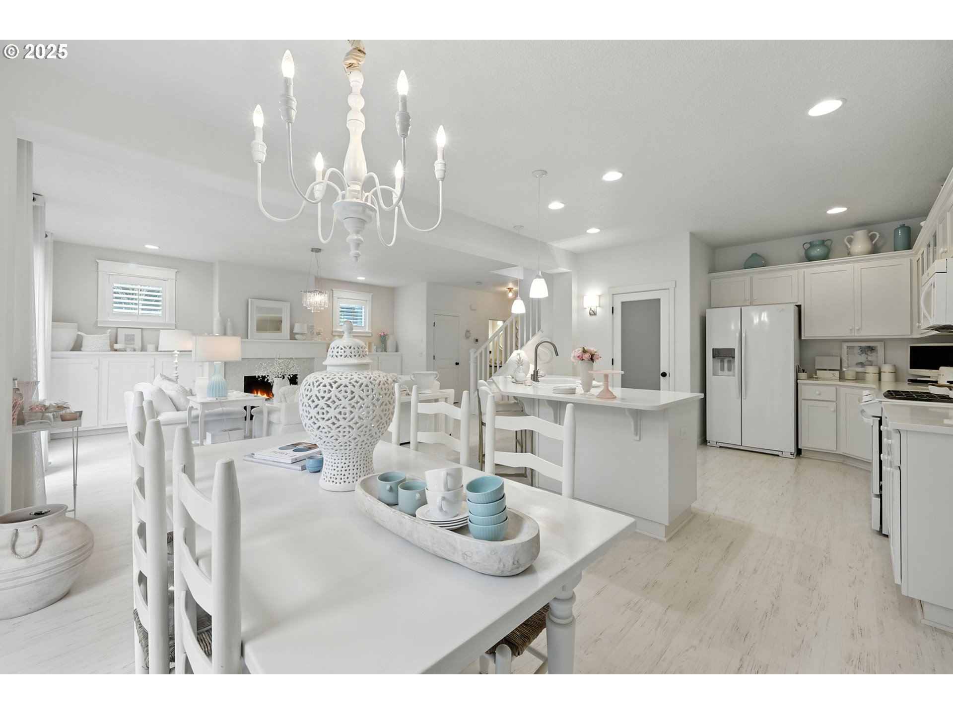 2210 South White Salmon Drive Ridgefield, WA 98642 - Photo 20 of 45 a kitchen with stainless steel appliances kitchen island granite countertop a table and chairs