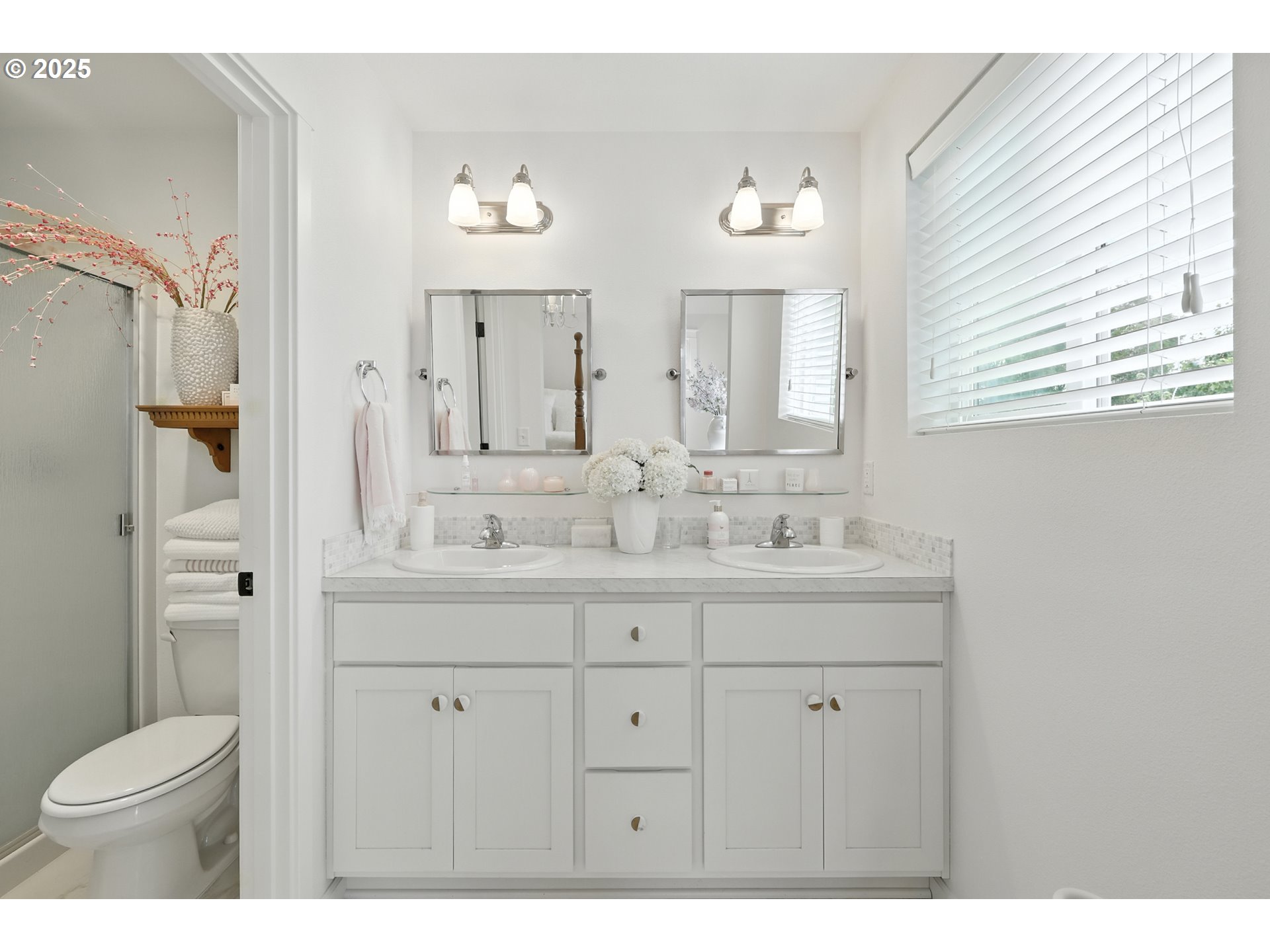 2210 South White Salmon Drive Ridgefield, WA 98642 - Photo 26 of 45 a bathroom with a granite countertop sink toilet a large mirror a vanity and shower