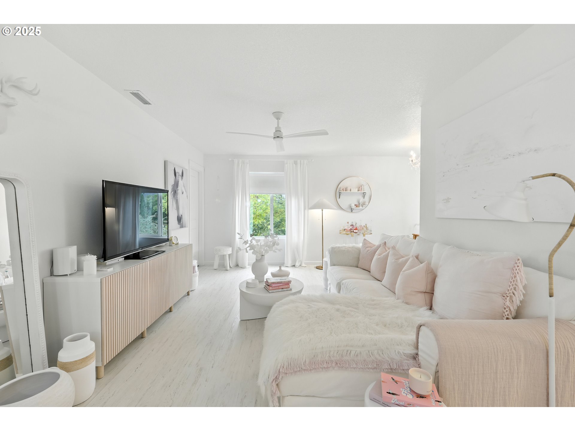 2210 South White Salmon Drive Ridgefield, WA 98642 - Photo 30 of 45 a living room with furniture and a flat screen tv