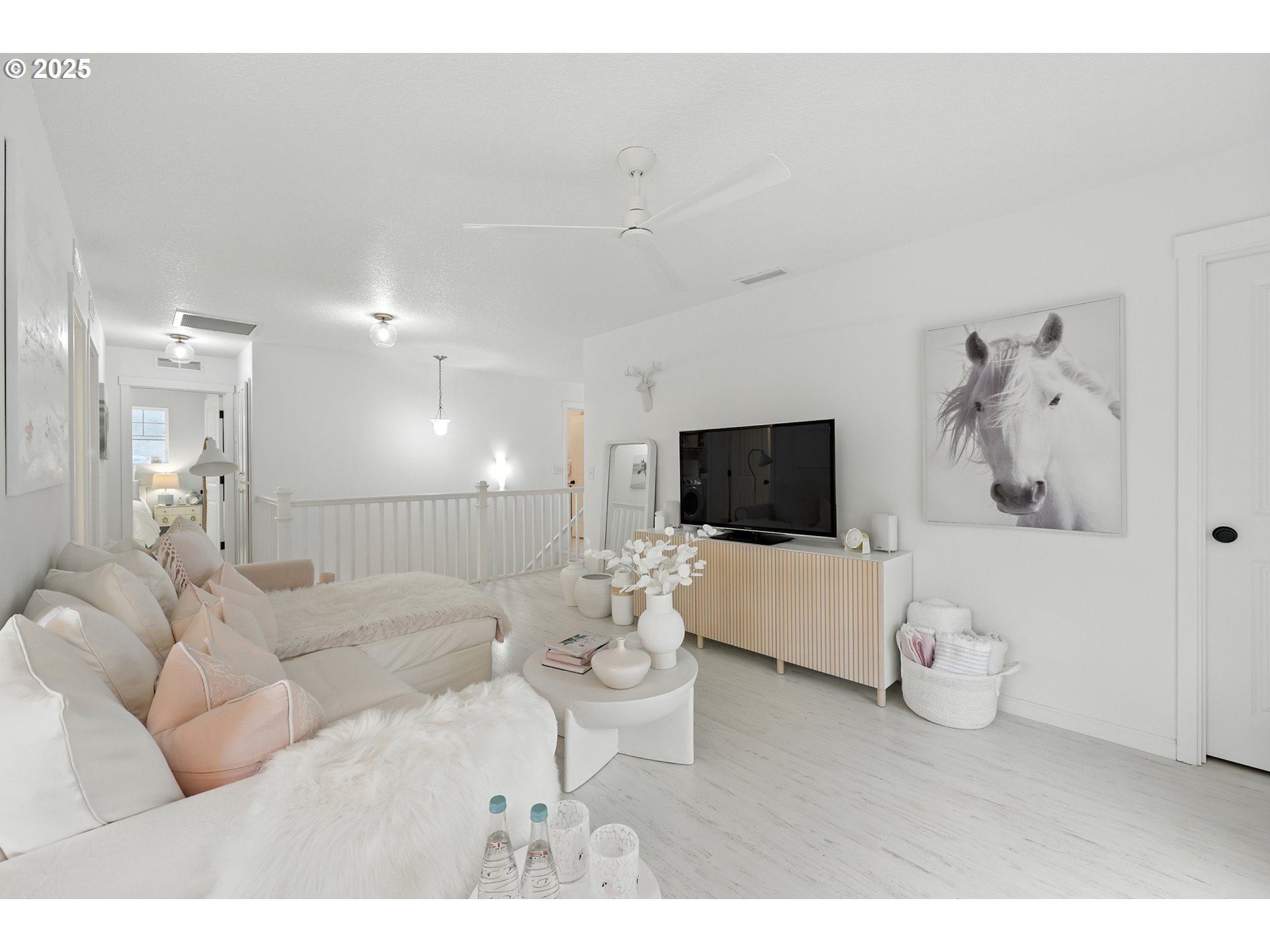 2210 South White Salmon Drive Ridgefield, WA 98642 - Photo 32 of 45 a living room with furniture and a flat screen tv